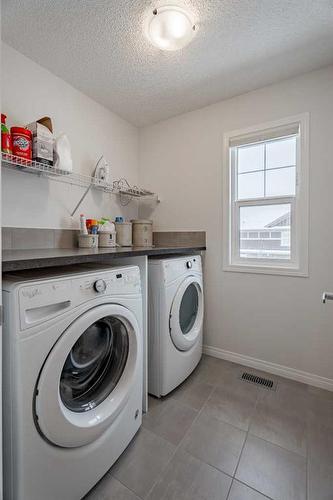 401 Clydesdale Way, Cochrane, AB - Indoor Photo Showing Laundry Room