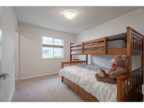 401 Clydesdale Way, Cochrane, AB - Indoor Photo Showing Bedroom