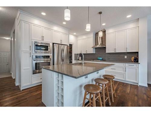 401 Clydesdale Way, Cochrane, AB - Indoor Photo Showing Kitchen With Upgraded Kitchen