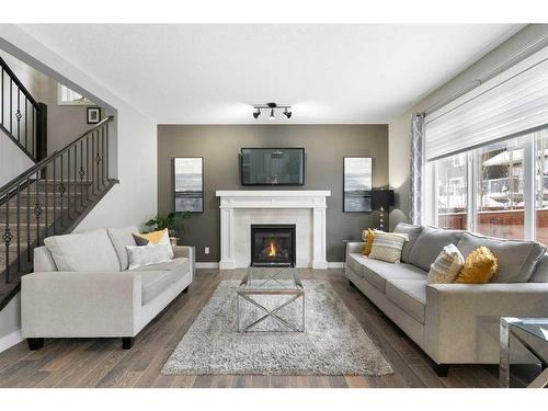 17 Riviera Bay, Cochrane, AB - Indoor Photo Showing Living Room With Fireplace