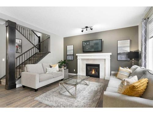 17 Riviera Bay, Cochrane, AB - Indoor Photo Showing Living Room With Fireplace