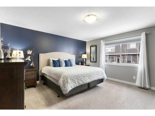 17 Riviera Bay, Cochrane, AB - Indoor Photo Showing Bedroom