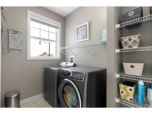 17 Riviera Bay, Cochrane, AB - Indoor Photo Showing Laundry Room