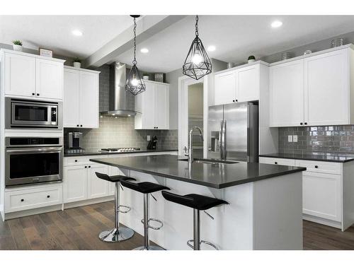 17 Riviera Bay, Cochrane, AB - Indoor Photo Showing Kitchen With Stainless Steel Kitchen With Upgraded Kitchen