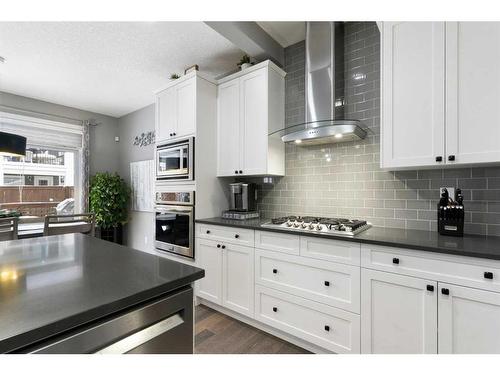 17 Riviera Bay, Cochrane, AB - Indoor Photo Showing Kitchen With Upgraded Kitchen