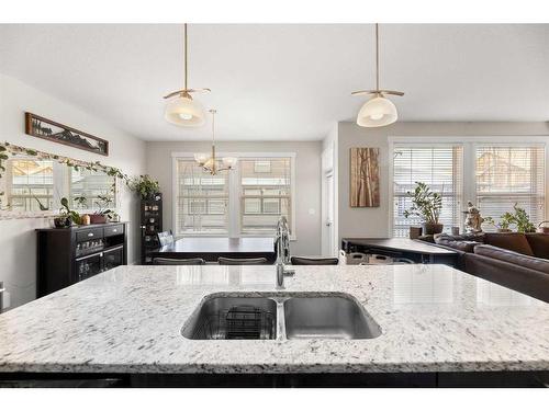 402-110 Coopers Common Sw, Airdrie, AB - Indoor Photo Showing Kitchen With Double Sink