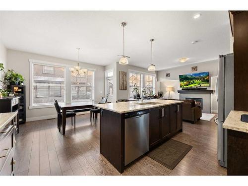 402-110 Coopers Common Sw, Airdrie, AB - Indoor Photo Showing Kitchen With Upgraded Kitchen