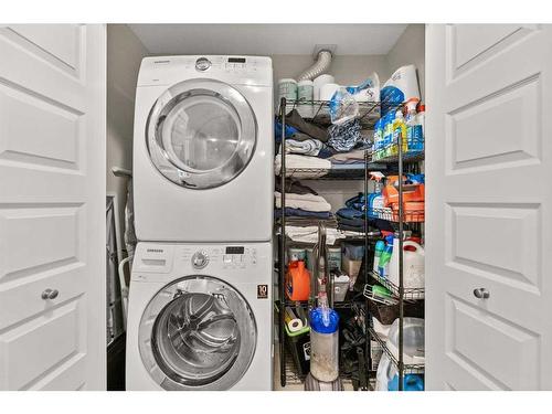 402-110 Coopers Common Sw, Airdrie, AB - Indoor Photo Showing Laundry Room