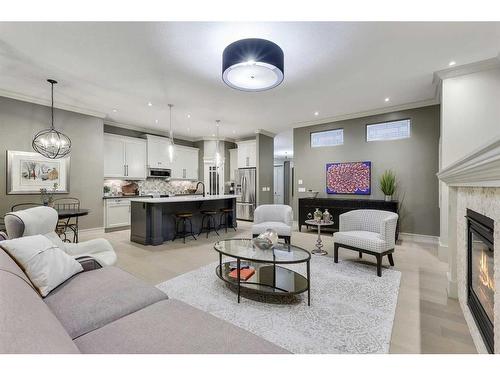 44 Bridle Estates Place Sw, Calgary, AB - Indoor Photo Showing Living Room With Fireplace