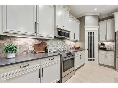 44 Bridle Estates Place Sw, Calgary, AB - Indoor Photo Showing Kitchen With Upgraded Kitchen