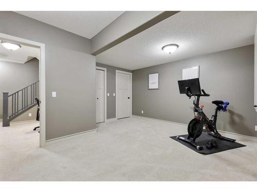 44 Bridle Estates Place Sw, Calgary, AB - Indoor Photo Showing Gym Room