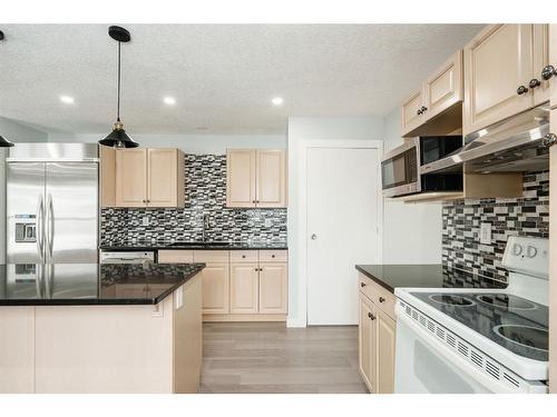 51 Falshire Place Ne, Calgary, AB - Indoor Photo Showing Kitchen With Upgraded Kitchen