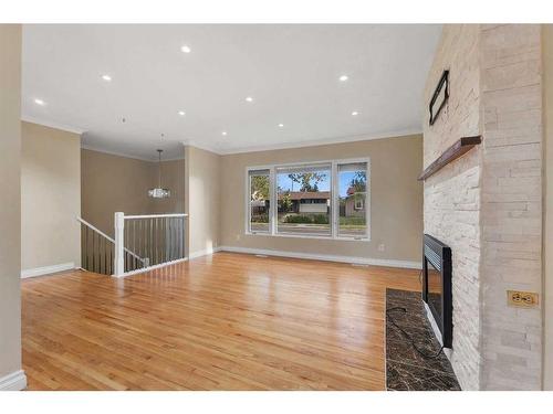 4704 Whitehorn Drive Ne, Calgary, AB - Indoor Photo Showing Living Room With Fireplace