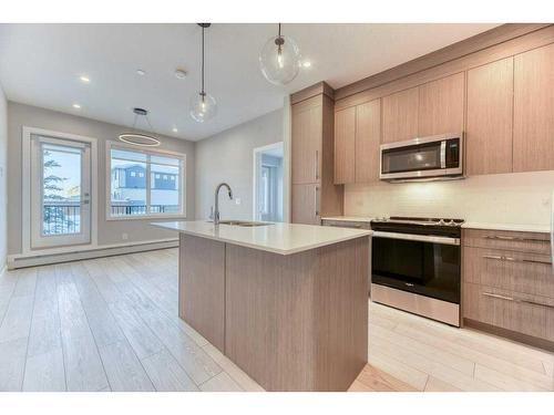 1109-111 Wolf Creek Drive, Calgary, AB - Indoor Photo Showing Kitchen With Upgraded Kitchen