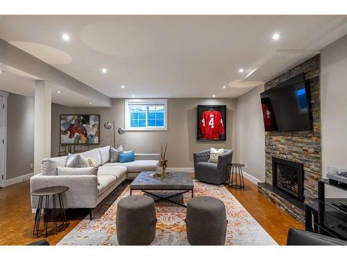 1023 Lake Bonavista Drive Se, Calgary, AB - Indoor Photo Showing Living Room With Fireplace