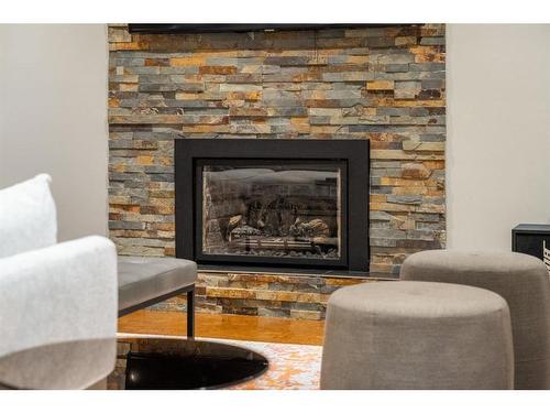 1023 Lake Bonavista Drive Se, Calgary, AB - Indoor Photo Showing Living Room With Fireplace