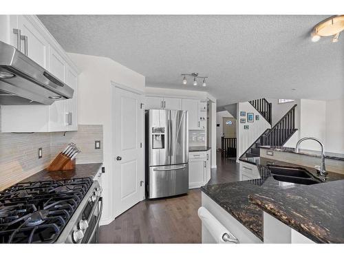 128 Tuscany Ravine Terrace Nw, Calgary, AB - Indoor Photo Showing Kitchen With Stainless Steel Kitchen With Double Sink With Upgraded Kitchen