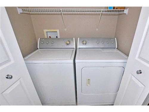 226 Evansmeade Close Nw, Calgary, AB - Indoor Photo Showing Laundry Room