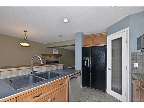 226 Evansmeade Close Nw, Calgary, AB - Indoor Photo Showing Kitchen With Double Sink