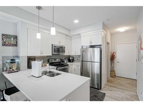 122-20 Seton Park Se, Calgary, AB - Indoor Photo Showing Kitchen With Stainless Steel Kitchen With Double Sink With Upgraded Kitchen