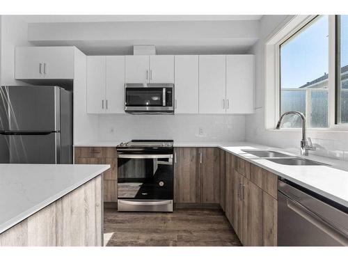 305-137 Red Embers Link Ne, Calgary, AB - Indoor Photo Showing Kitchen With Stainless Steel Kitchen With Double Sink With Upgraded Kitchen