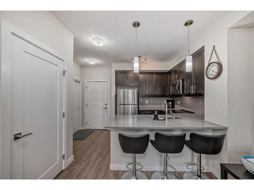 103-300 Auburn Meadows Manor Se, Calgary, AB - Indoor Photo Showing Kitchen With Upgraded Kitchen