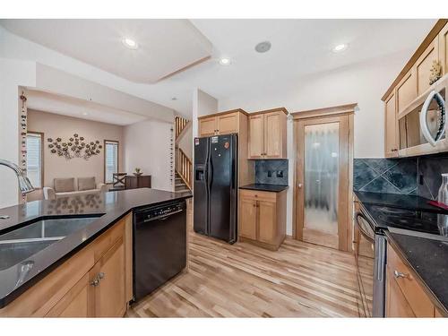 261 Tuscany Ridge Heights Nw, Calgary, AB - Indoor Photo Showing Kitchen With Double Sink