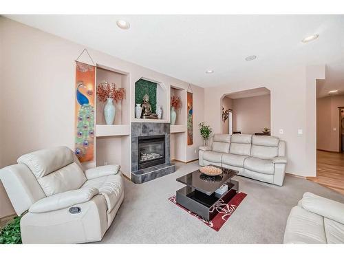 261 Tuscany Ridge Heights Nw, Calgary, AB - Indoor Photo Showing Living Room With Fireplace