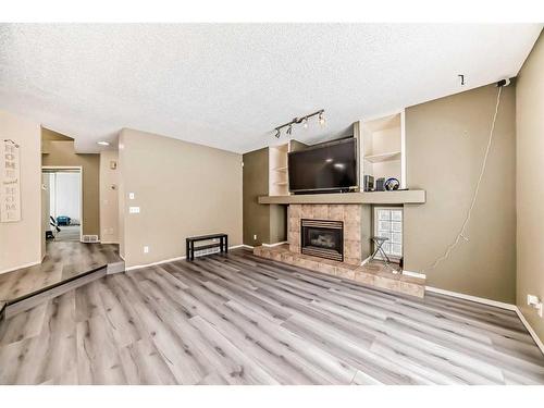 192 Citadel Green Nw, Calgary, AB - Indoor With Fireplace