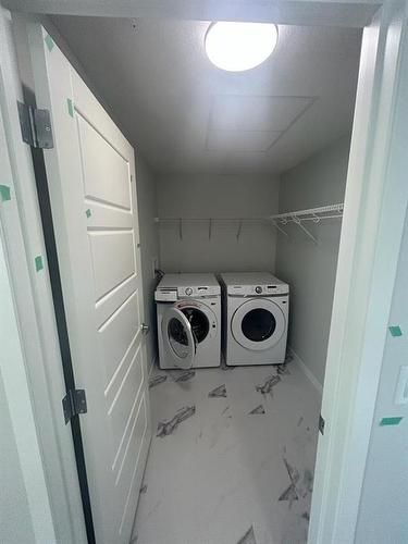 1302-220 Seton Grove, Calgary, AB - Indoor Photo Showing Laundry Room