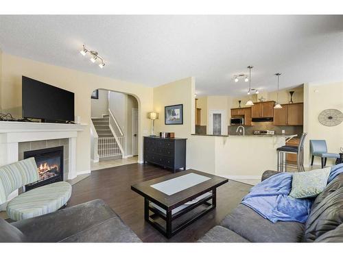 224 Silverado Range Heights Sw, Calgary, AB - Indoor Photo Showing Living Room With Fireplace