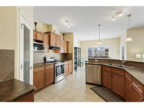 224 Silverado Range Heights Sw, Calgary, AB - Indoor Photo Showing Kitchen With Double Sink