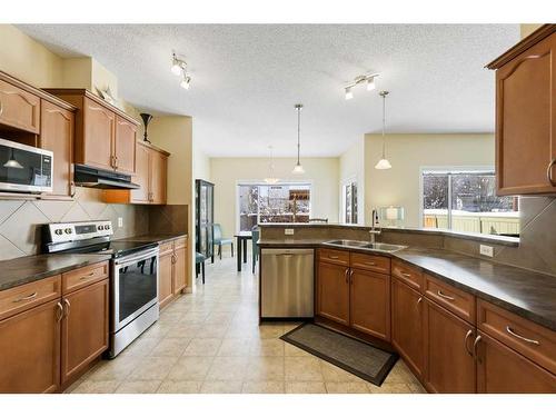 224 Silverado Range Heights Sw, Calgary, AB - Indoor Photo Showing Kitchen With Double Sink