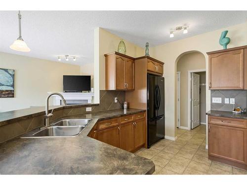 224 Silverado Range Heights Sw, Calgary, AB - Indoor Photo Showing Kitchen With Double Sink