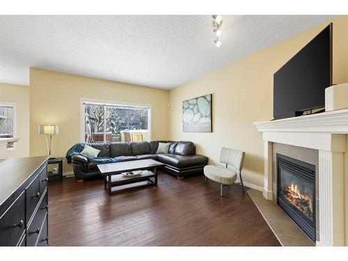 224 Silverado Range Heights Sw, Calgary, AB - Indoor Photo Showing Living Room With Fireplace