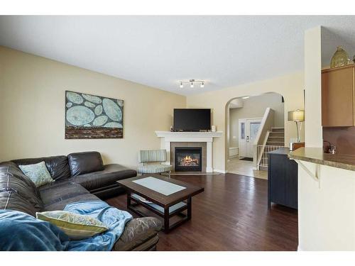 224 Silverado Range Heights Sw, Calgary, AB - Indoor Photo Showing Living Room With Fireplace