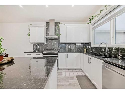 240 Belmont Boulevard Sw, Calgary, AB - Indoor Photo Showing Kitchen With Double Sink