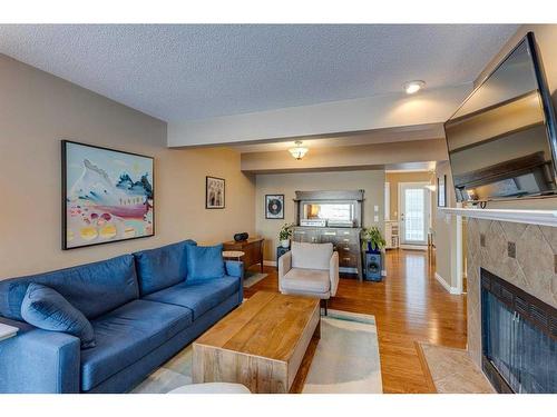 1-533 14 Avenue Sw, Calgary, AB - Indoor Photo Showing Living Room With Fireplace