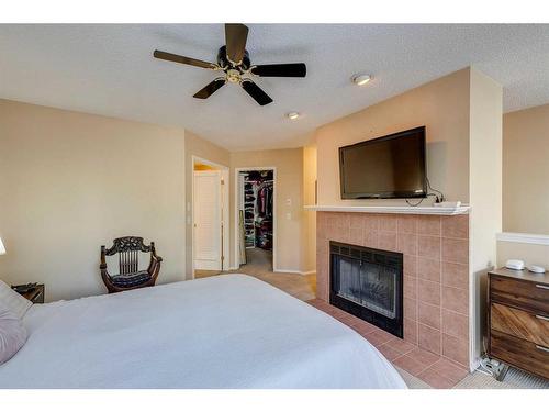 1-533 14 Avenue Sw, Calgary, AB - Indoor Photo Showing Bedroom With Fireplace