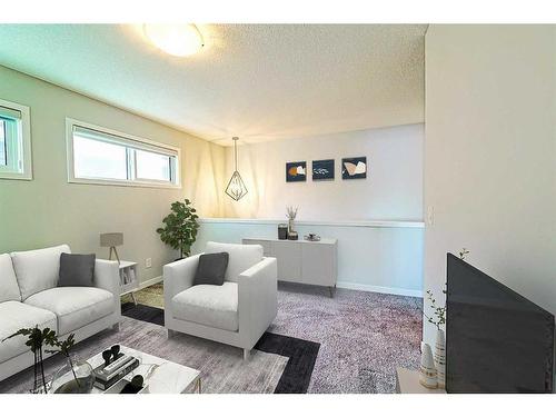 36 Belmont Terrace Sw, Calgary, AB - Indoor Photo Showing Living Room