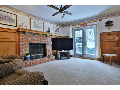 47 Edenwold Crescent Nw, Calgary, AB - Indoor Photo Showing Living Room With Fireplace