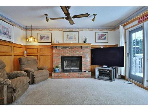 47 Edenwold Crescent Nw, Calgary, AB - Indoor Photo Showing Living Room With Fireplace