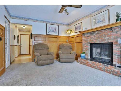 47 Edenwold Crescent Nw, Calgary, AB - Indoor Photo Showing Living Room With Fireplace