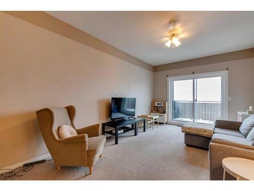 403-16 Poplar Avenue, Okotoks, AB - Indoor Photo Showing Living Room