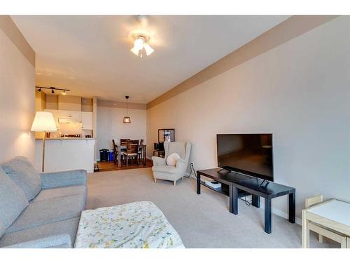 403-16 Poplar Avenue, Okotoks, AB - Indoor Photo Showing Living Room