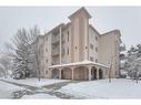 403-16 Poplar Avenue, Okotoks, AB  - Outdoor With Balcony With Facade 