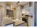 403-16 Poplar Avenue, Okotoks, AB  - Indoor Photo Showing Kitchen With Double Sink 