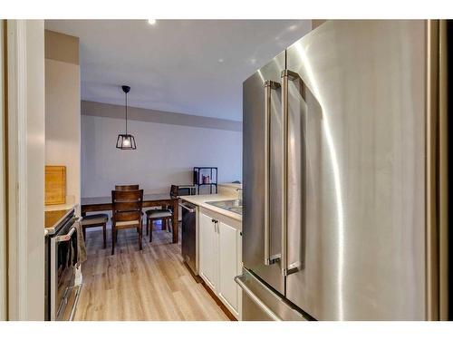 403-16 Poplar Avenue, Okotoks, AB - Indoor Photo Showing Kitchen