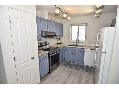 227 Costa Mesa Close Ne, Calgary, AB - Indoor Photo Showing Kitchen With Double Sink