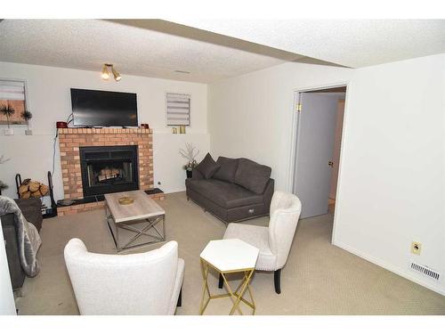 227 Costa Mesa Close Ne, Calgary, AB - Indoor Photo Showing Living Room With Fireplace